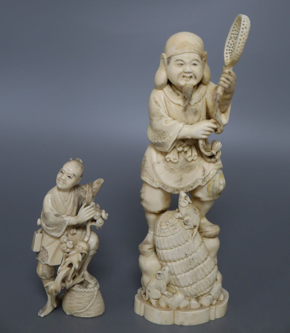 A Japanese ivory okimono of an elder and a dragon, and a marine ivory carving of Daikoku, tallest 25cm